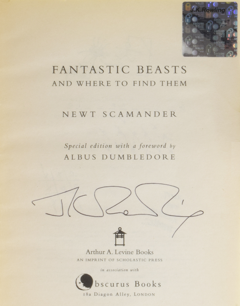 JK Rowling Forgery with an authentic hologram inside of a Fantastic Beasts and Where to Find Them being sold by Adrian Harrington Rare Books