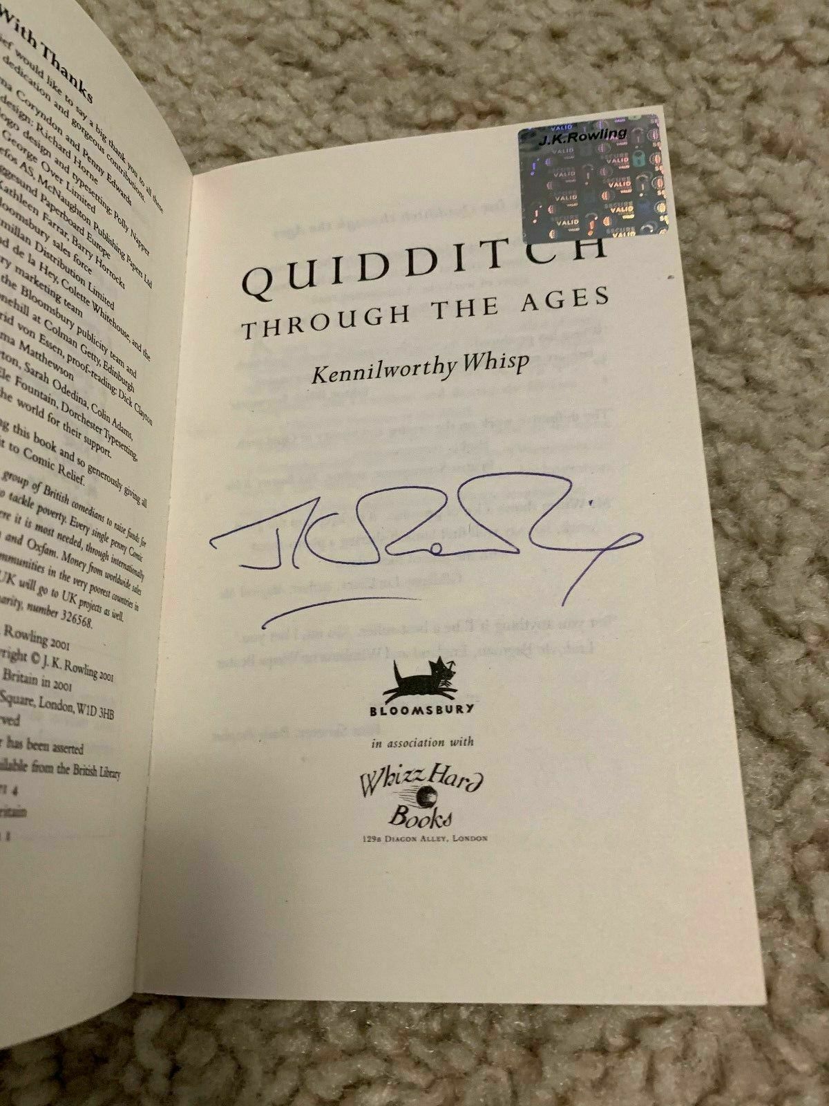 J.K. Rowling signature forgery inside a Quidditch Through the Ages with an authentic Rowling hologram, which was pulled from an authentically signed but lesser valued book. Found on eBay. Sold by rwsellers.